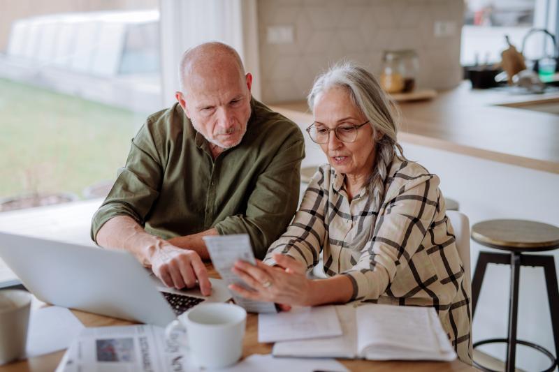 elderly couple on an online counseling session