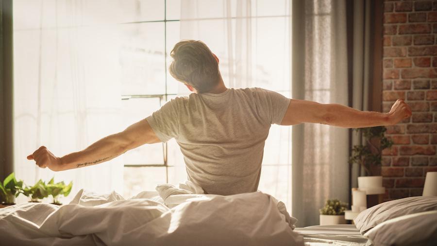 man getting out of bed