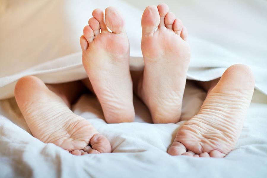 sexually satisfied couple in bed