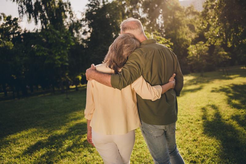 middle-aged couple walking outdoors
