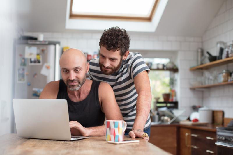 gay couple browsing online
