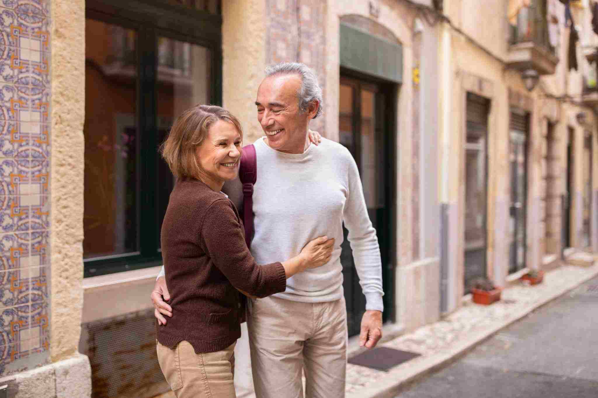 elderly couple walking around