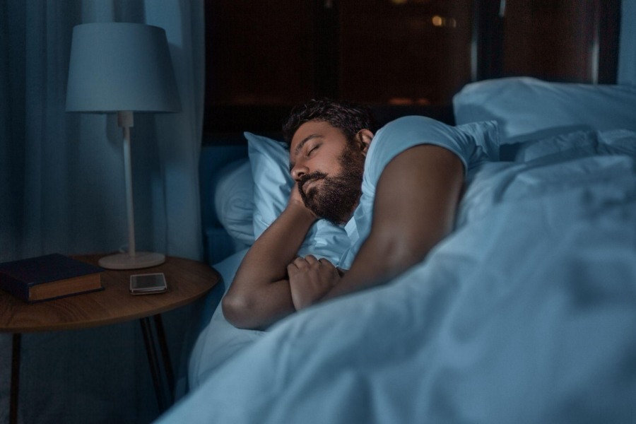 man sleeping after taking melatonin