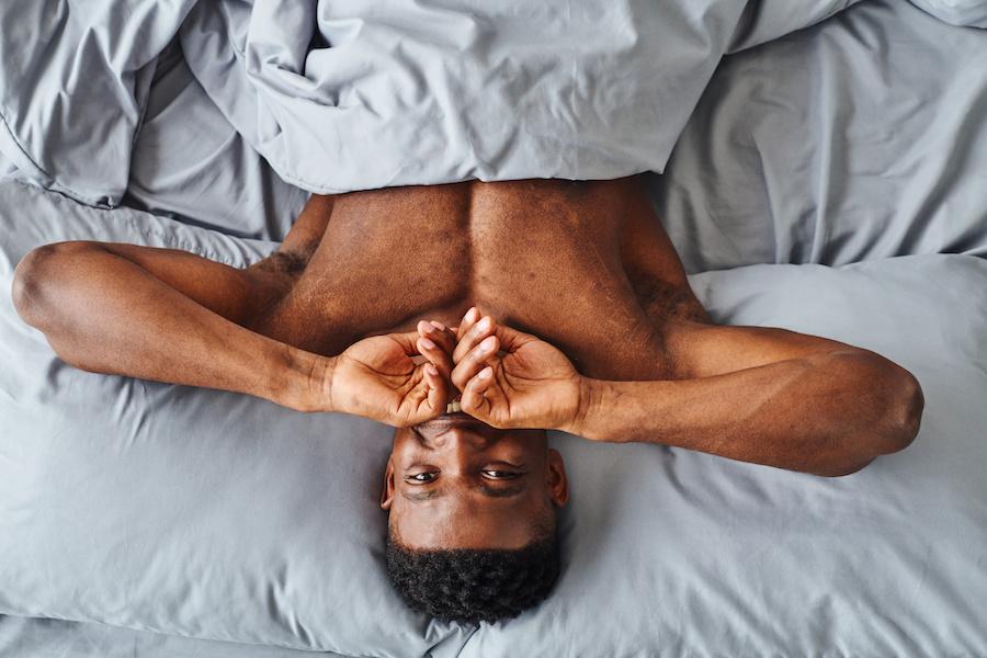 satisfied man in bed