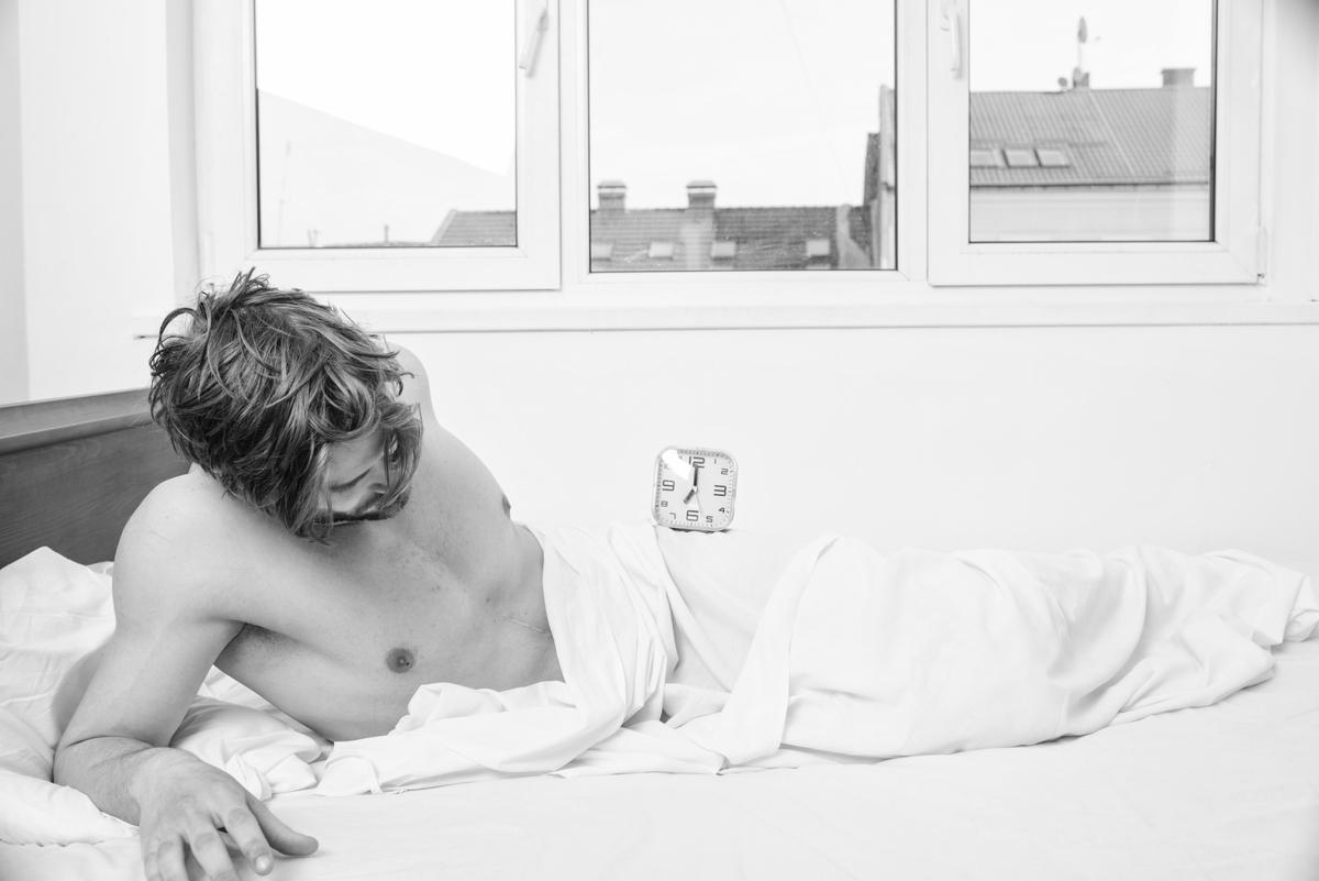 Man Laying in Bed