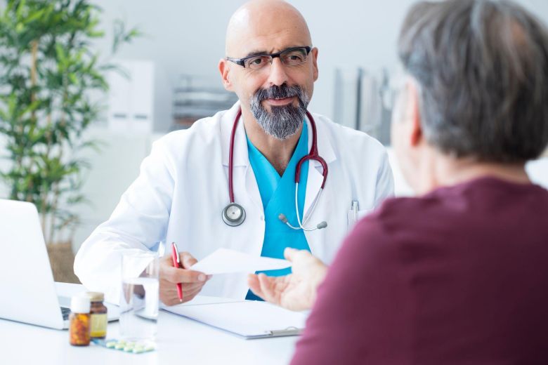 doctor and patient discussing penis enlargement options