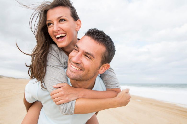 happy couple on the beach