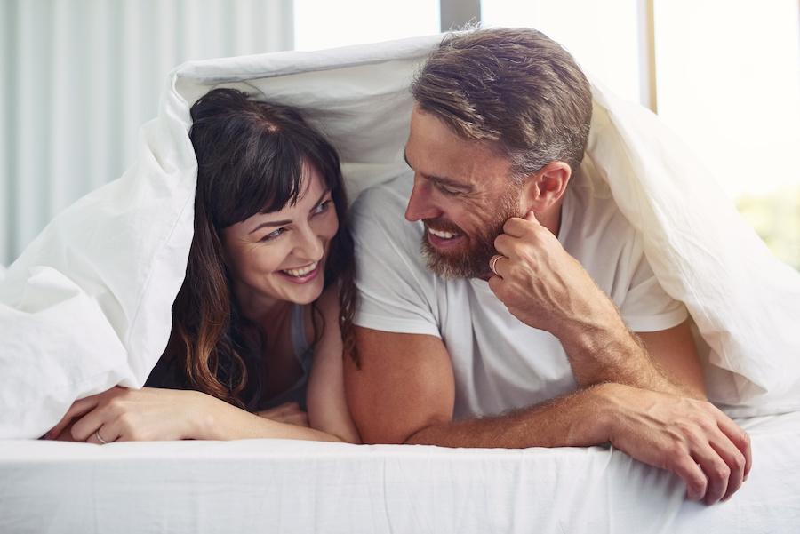 sexually satisfied couple in bed