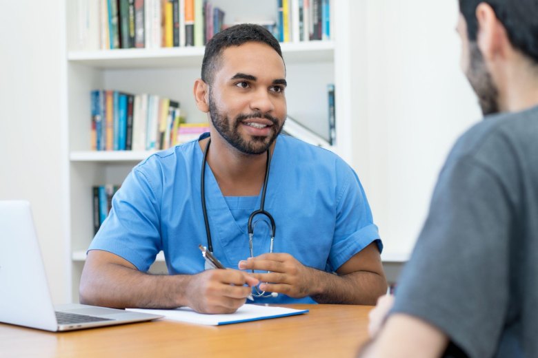 doctor talking with patient about erectile tissue damage