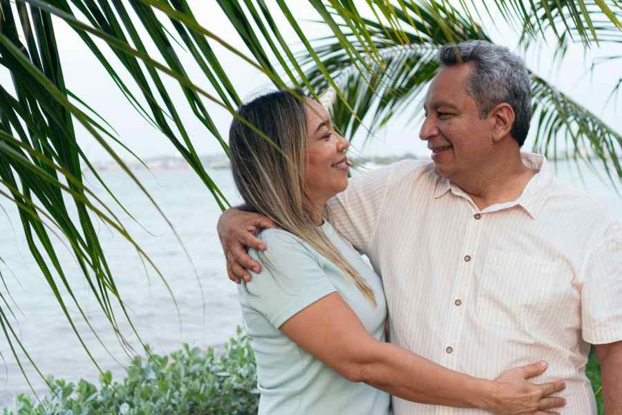 happy couple hugging on the beach