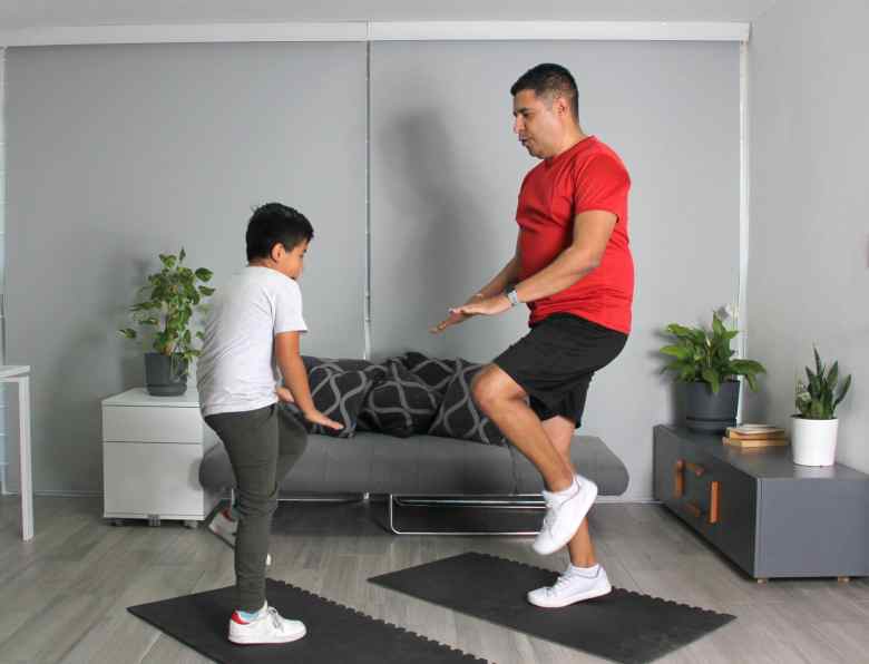 javier exercising with his little son