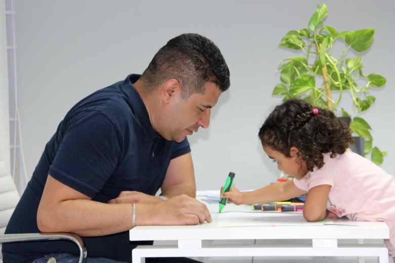 javier helping his daughter with her homework