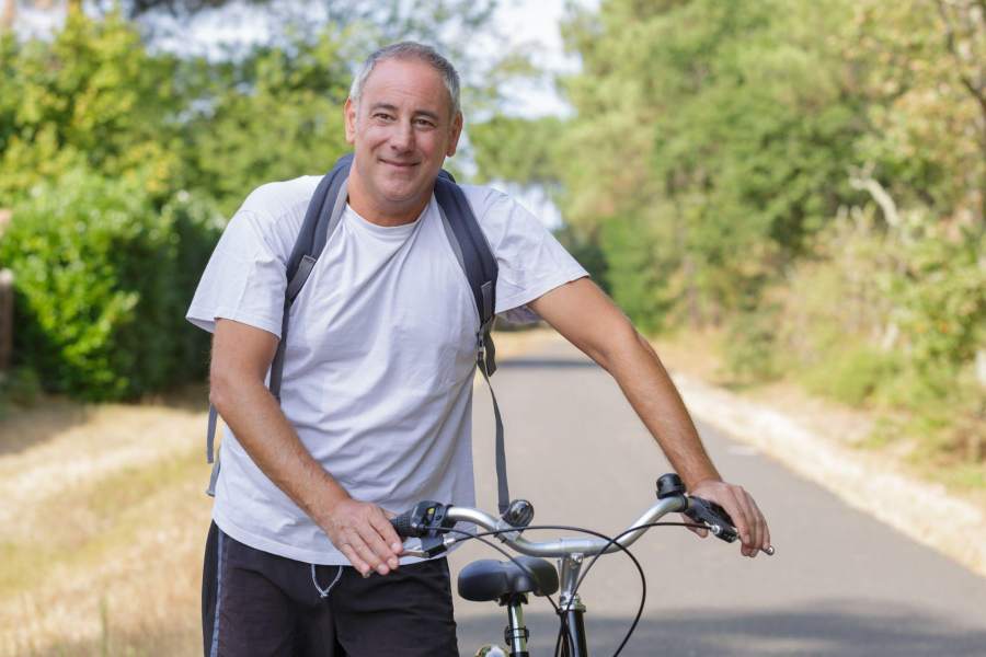 man going for a bike ride outdoors