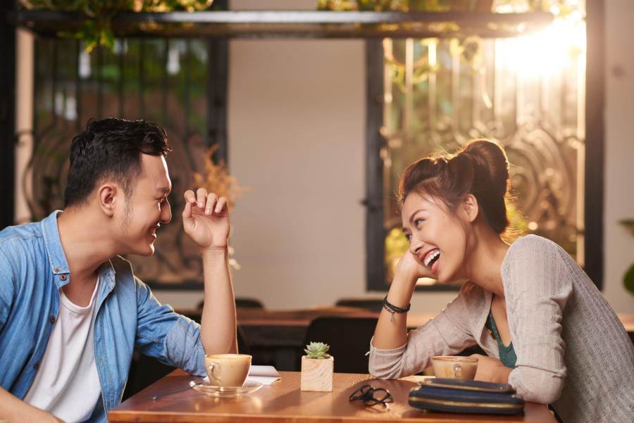 young couple happily chatting in a restaurant