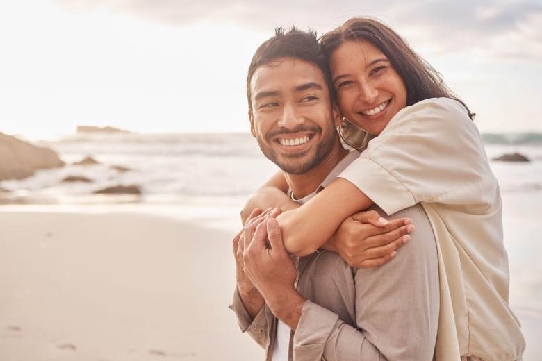 young couple hugging on the beach