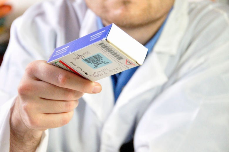 doctor handing over a viagra prescription to patient