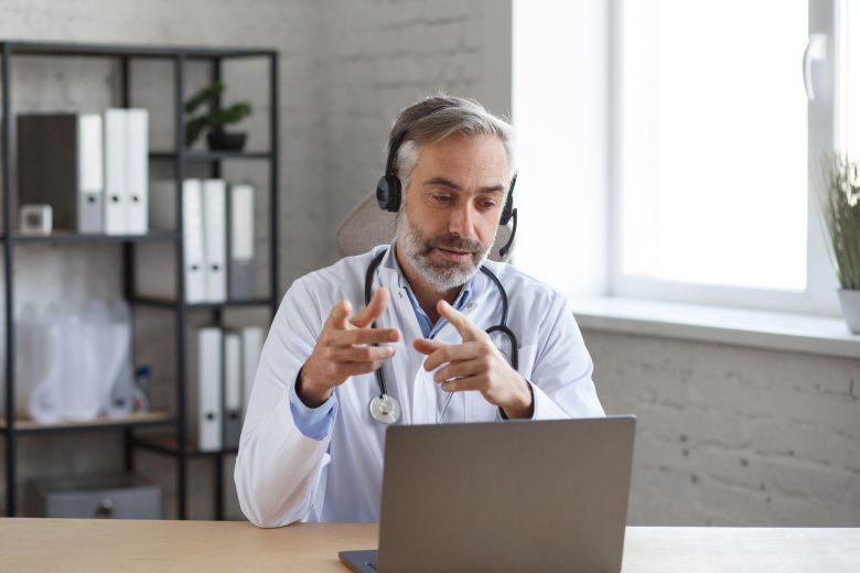doctor on an appointment with a patient over the computer - telemedicine