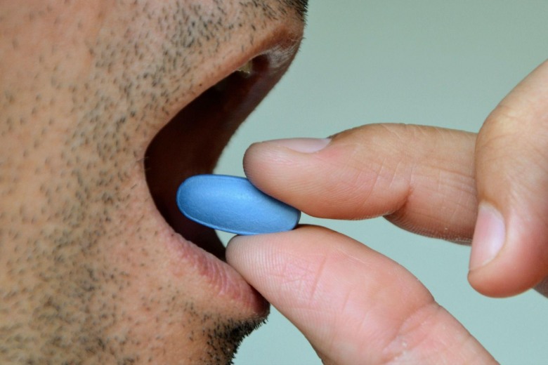 man taking viagra pill