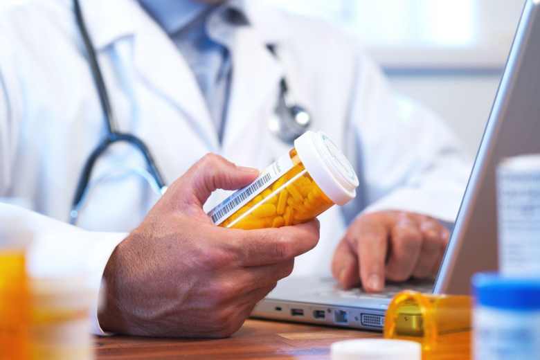 doctor holding a pill bottle