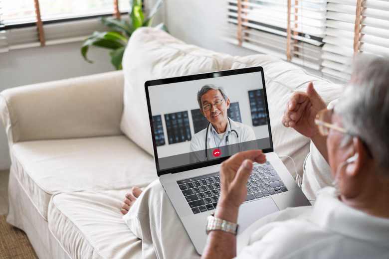 senior man having a telecall with his doctor