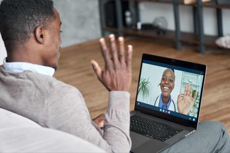 young man having a telecall with a female doctor