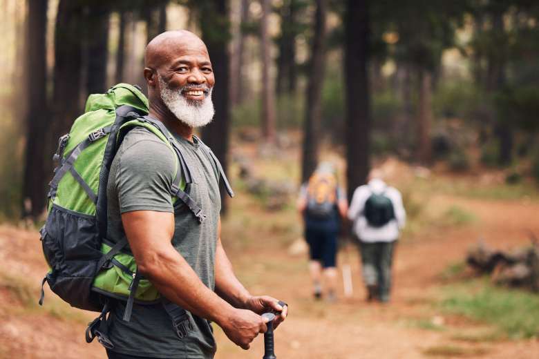 black middle-aged man hiking