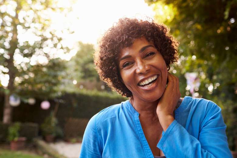black short-haired woman smiling