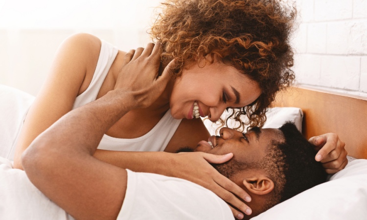 Intimate Couple Embracing in Bed, Promoting Sexual Health