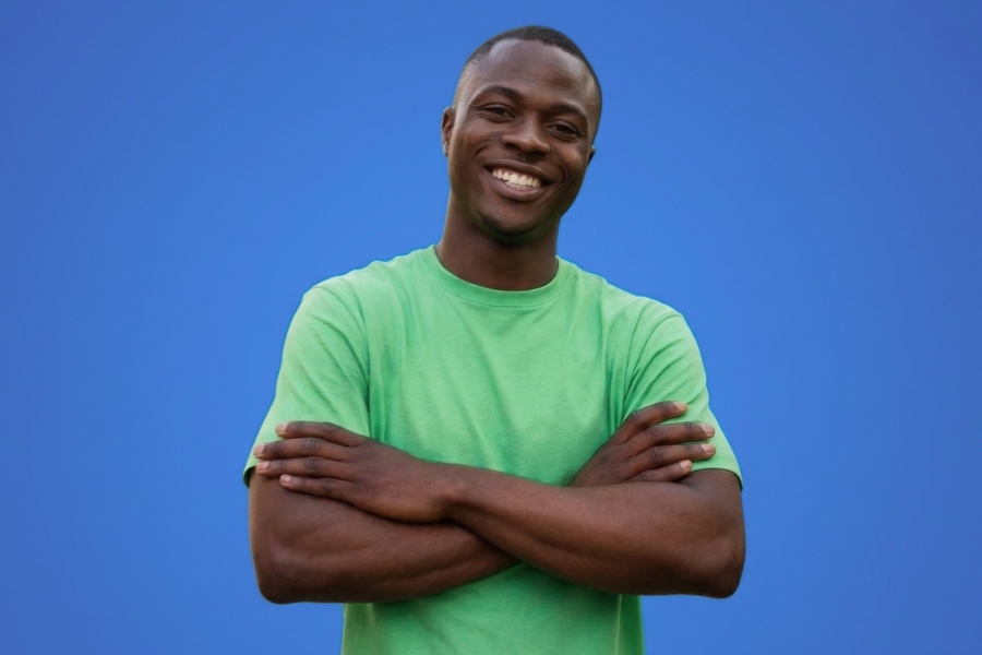 Confident smiling man with arms crossed, men's health bundle results